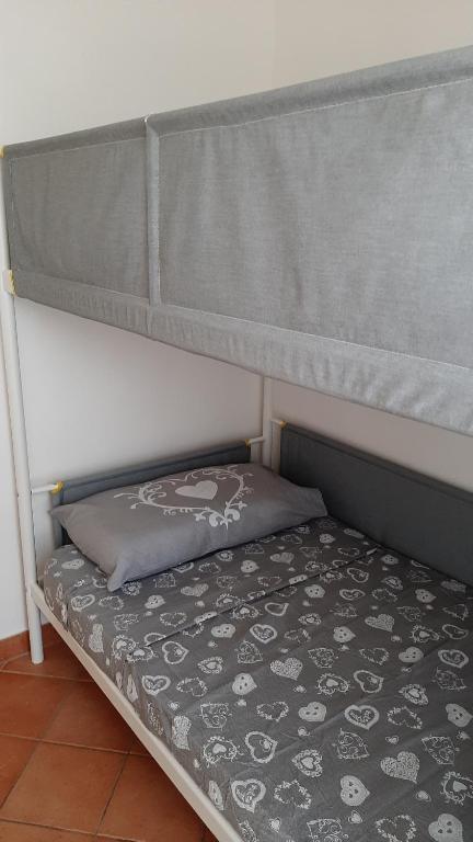 Postel nebo postele na pokoji v ubytování Appartamento Residence Mirice Vignola mare Aglientu casa Mattia