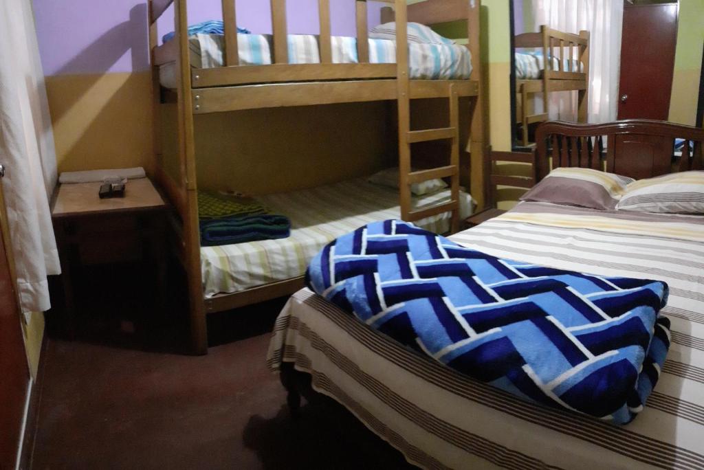 Postel nebo postele na pokoji v ubytování Hostal Jovita