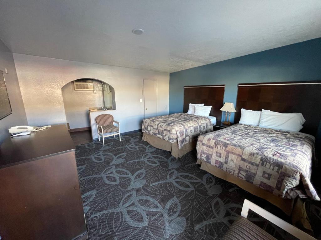 Postel nebo postele na pokoji v ubytování Sands Motel
