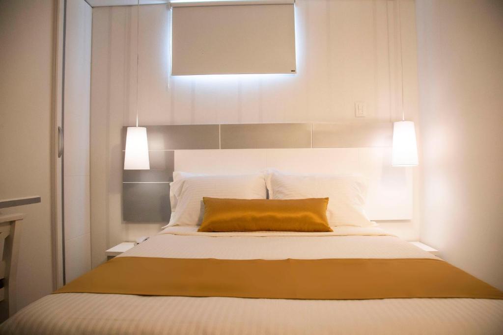 Postel nebo postele na pokoji v ubytování Hotel Silver Guarne