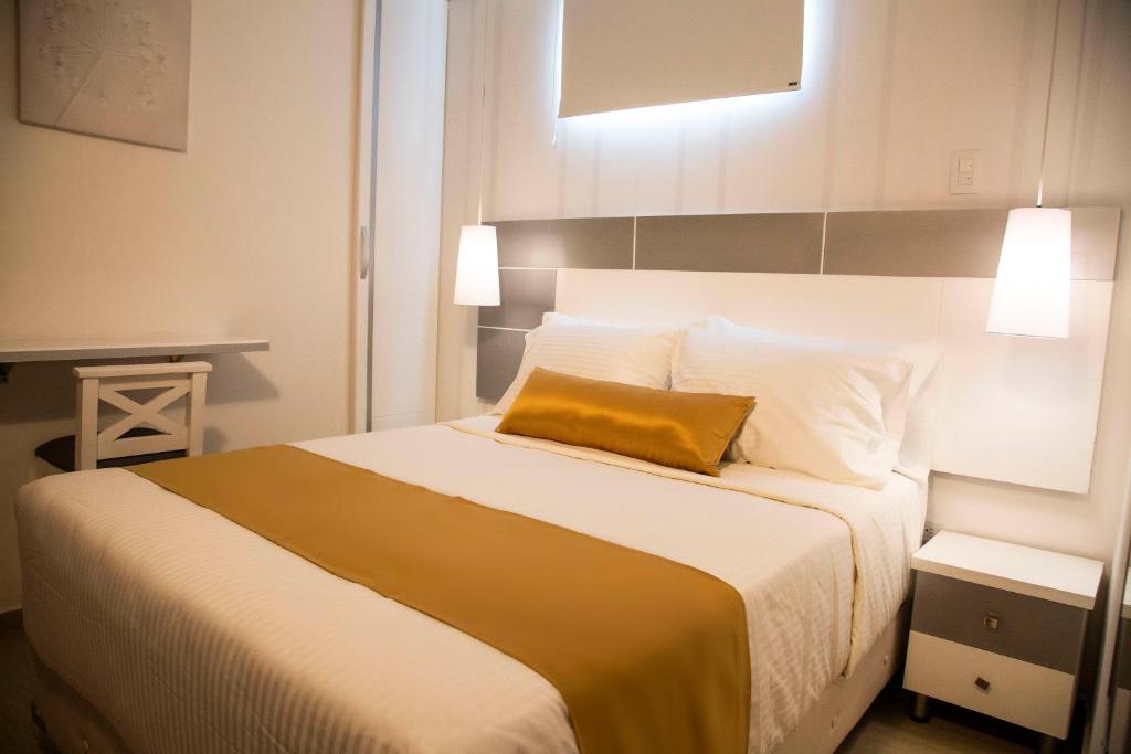 Postel nebo postele na pokoji v ubytování Hotel Silver Guarne