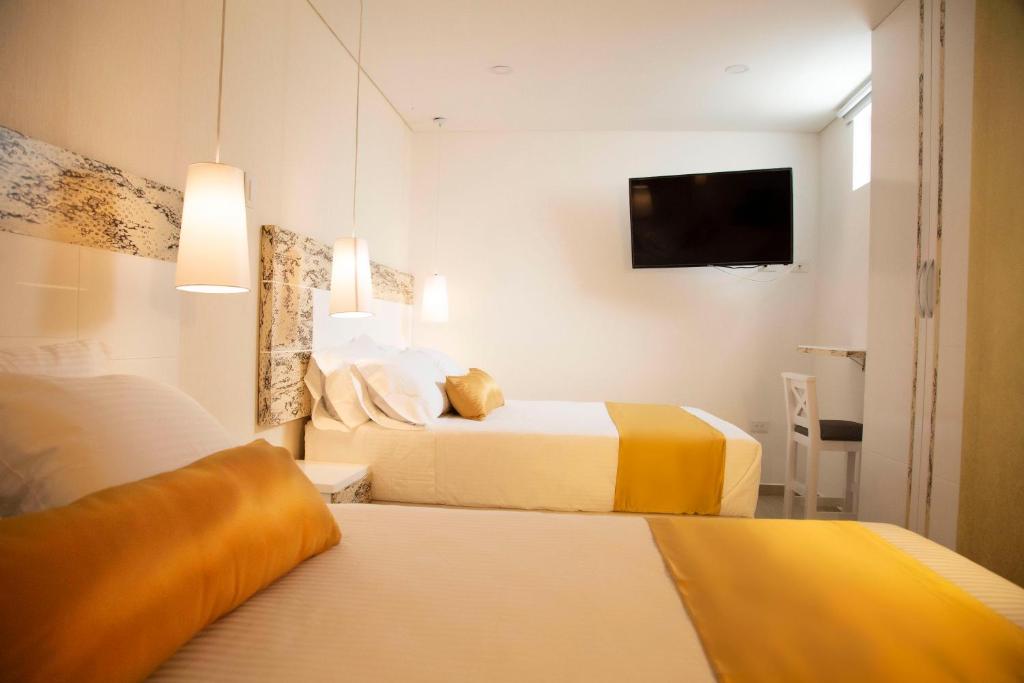 Postel nebo postele na pokoji v ubytování Hotel Silver Guarne