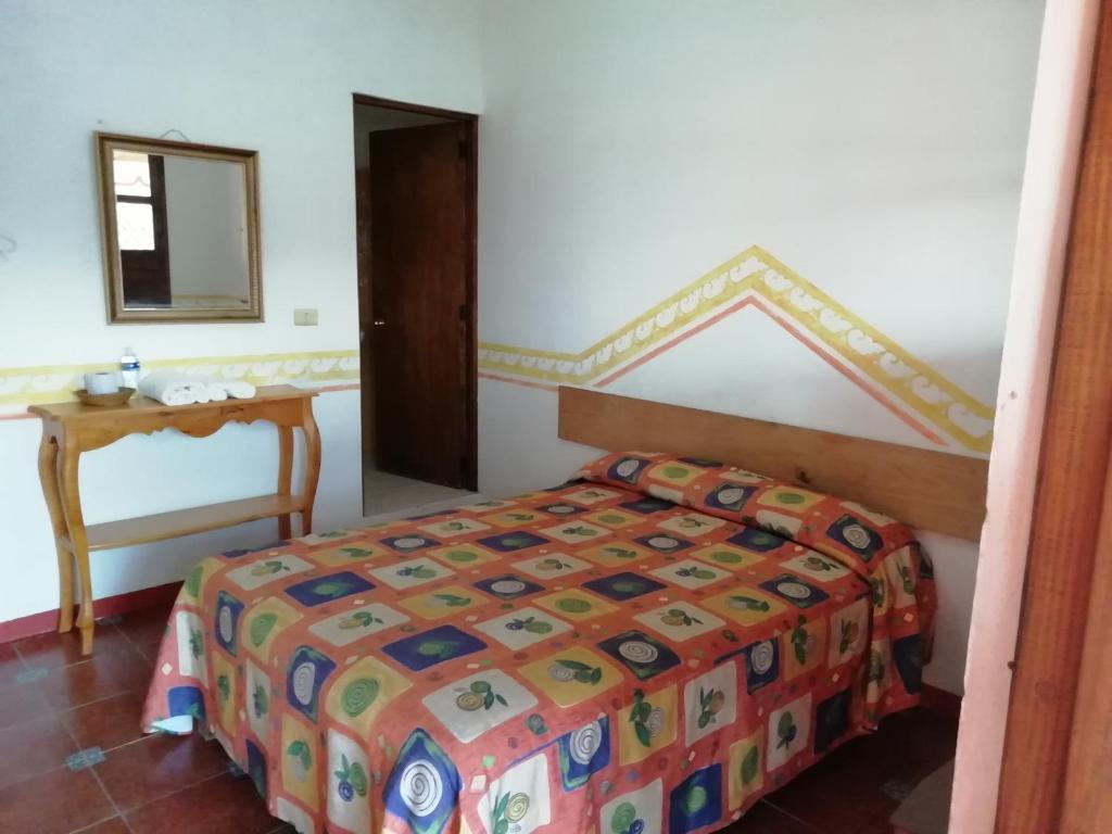 Postel nebo postele na pokoji v ubytování Posada Los Naranjos