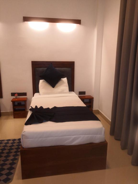 Postel nebo postele na pokoji v ubytování Kudila Resort