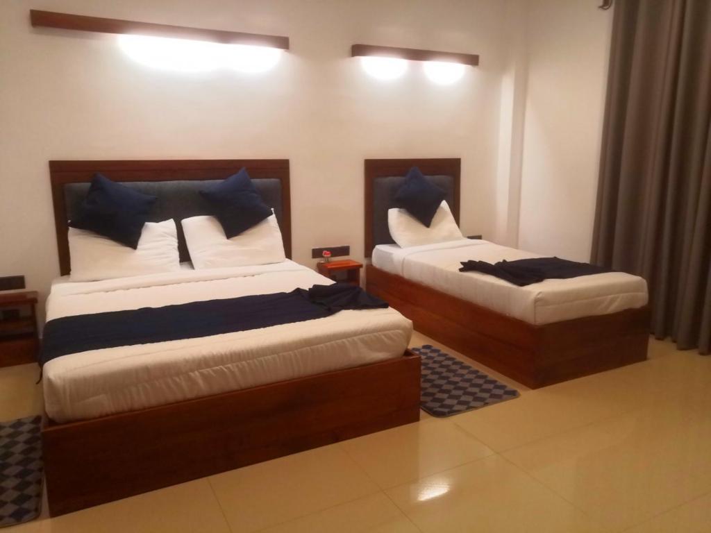Postel nebo postele na pokoji v ubytování Kudila Resort