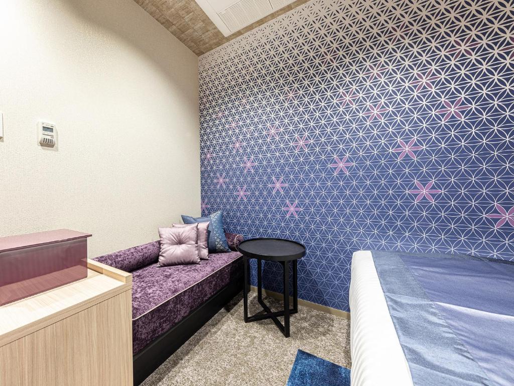 Postel nebo postele na pokoji v ubytování Hotel Musse Kyoto Shijo Kawaramachi Meitetsu