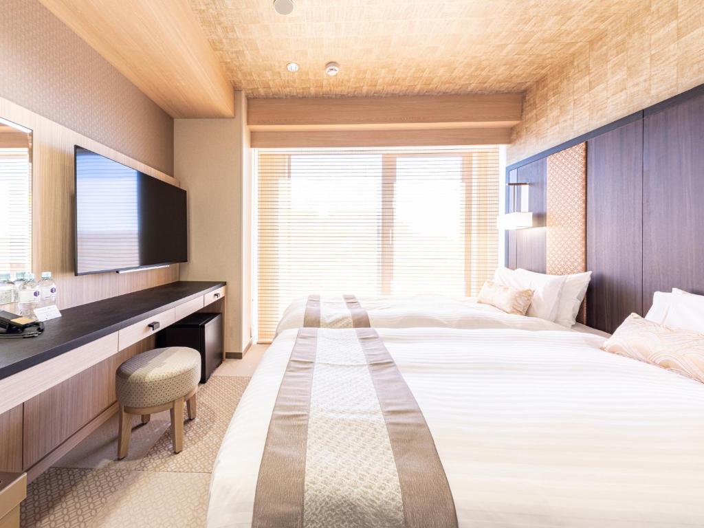 Postel nebo postele na pokoji v ubytování Hotel Musse Kyoto Shijo Kawaramachi Meitetsu