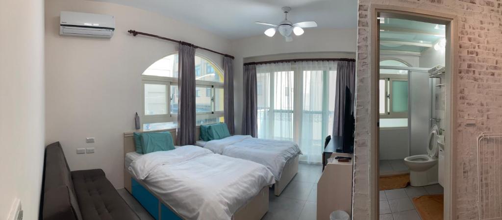 Postel nebo postele na pokoji v ubytování Sea Man Homestay