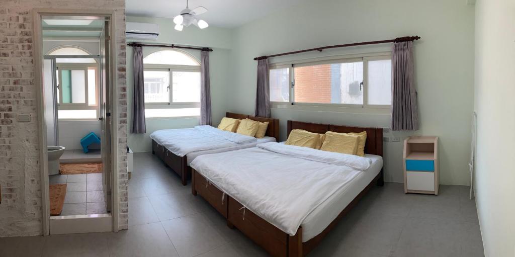 Postel nebo postele na pokoji v ubytování Sea Man Homestay