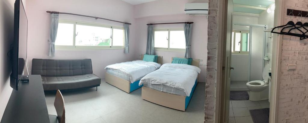 Postel nebo postele na pokoji v ubytování Sea Man Homestay