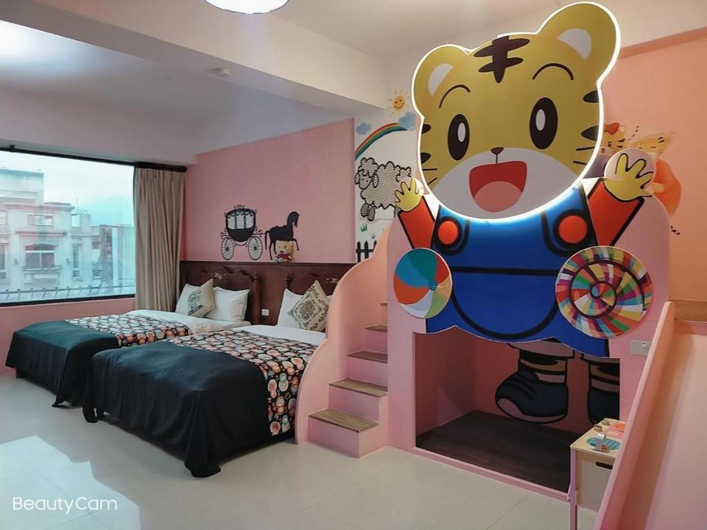 a bedroom with a mickey mouse mural on the wall at Zhong Shan 330 in Hualien City