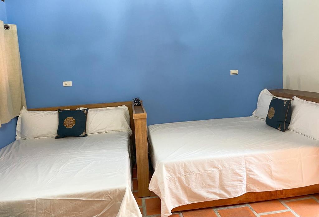 Postel nebo postele na pokoji v ubytování Xinqin B&B - City Area