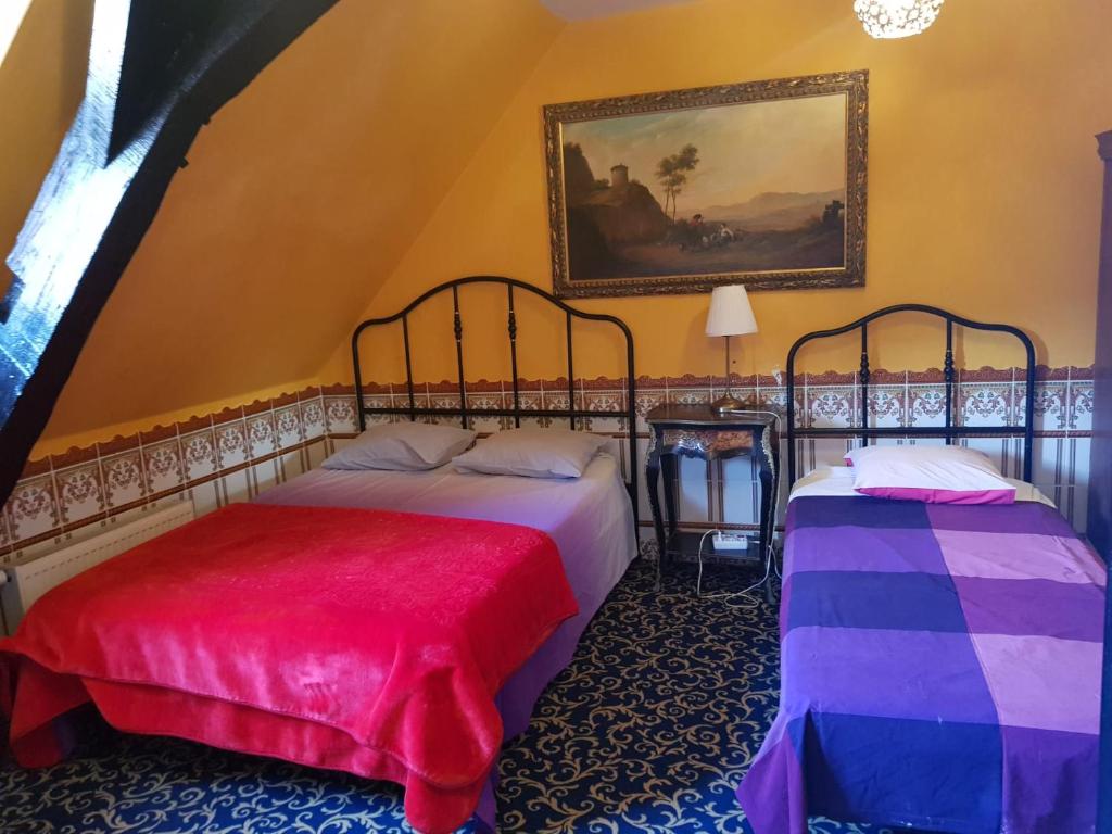 Postel nebo postele na pokoji v ubytování Hotel Mozart