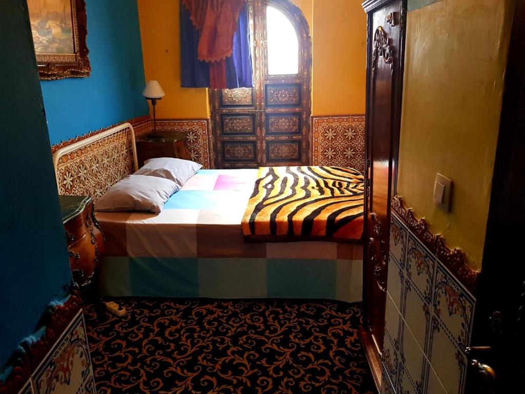 Postel nebo postele na pokoji v ubytování Hotel Mozart