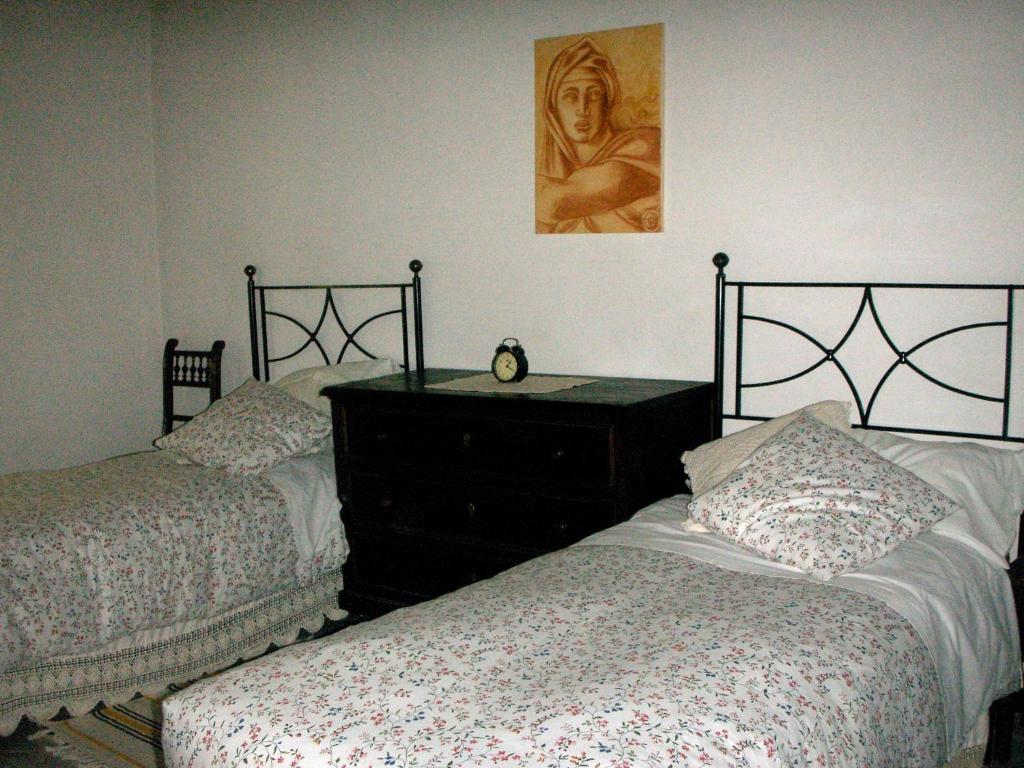 Postel nebo postele na pokoji v ubytování Poggio Etrusco sas di Sheldon Johns Pamela Kay