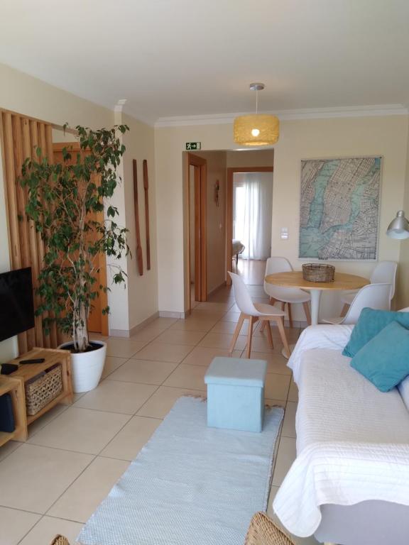 a living room with two couches and a table at Casas do Mar - Baleal 1 - Sea House in Baleal