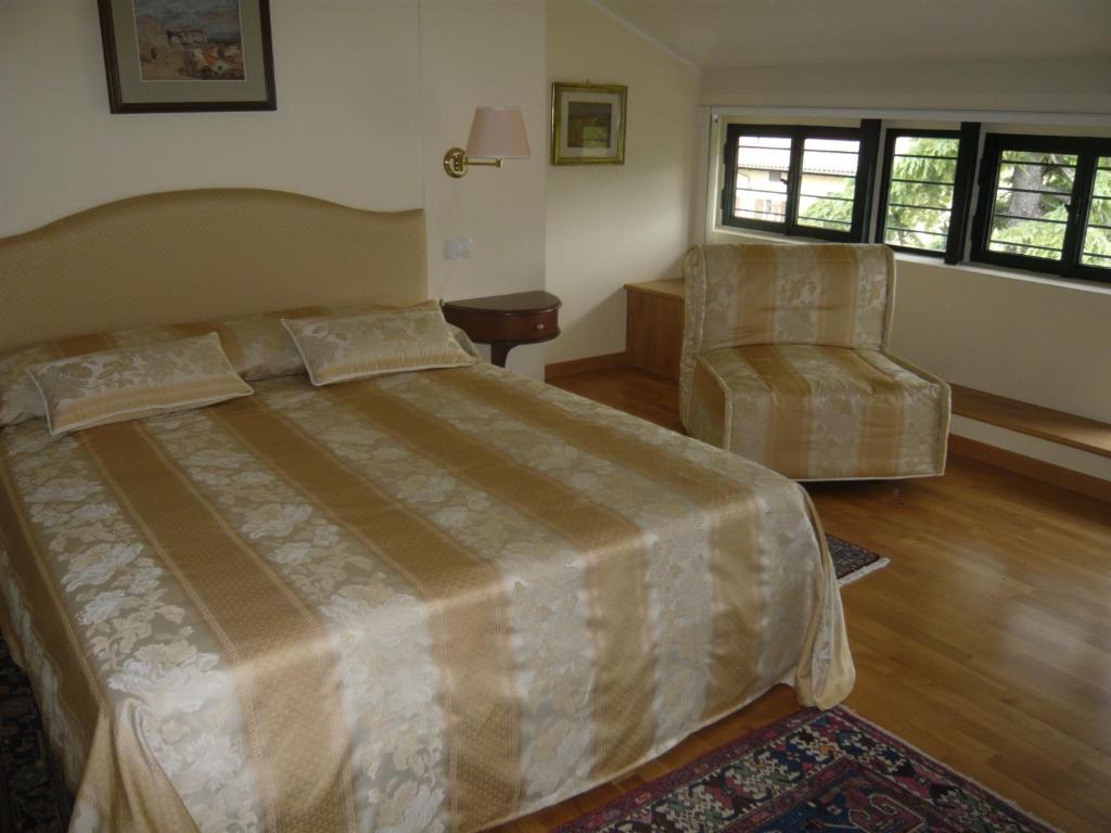 Postel nebo postele na pokoji v ubytování Relais Villa Selle
