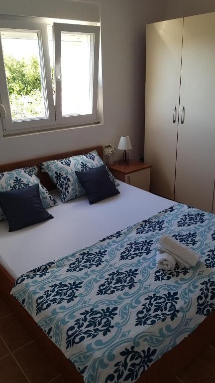 Posteľ alebo postele v izbe v ubytovaní Apartments Bralic