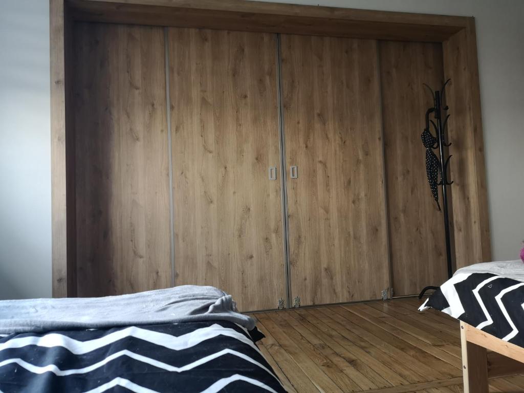 Postel nebo postele na pokoji v ubytování Wrota Biebrzy