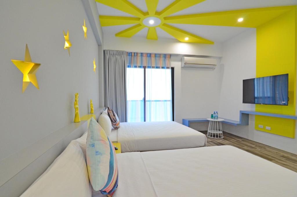 Postel nebo postele na pokoji v ubytování Haipai Sweetheart Homestay