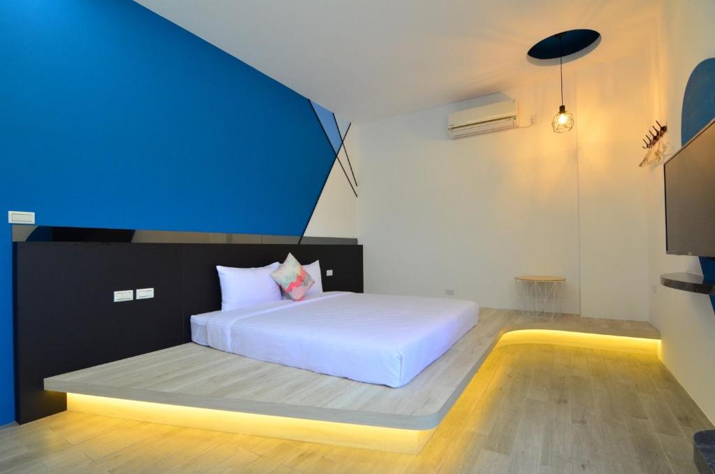 Postel nebo postele na pokoji v ubytování Haipai Sweetheart Homestay