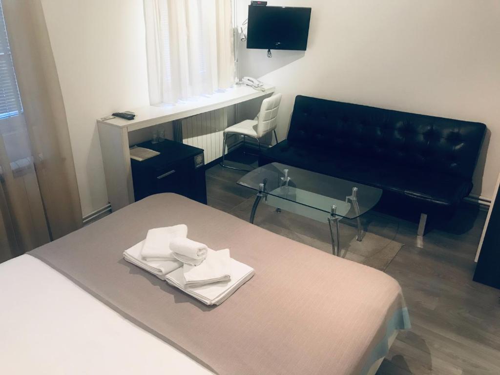 TV a/nebo společenská místnost v ubytování Garni hotel King