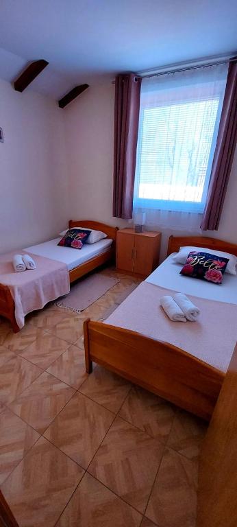 Postel nebo postele na pokoji v ubytování Apartment Molnar