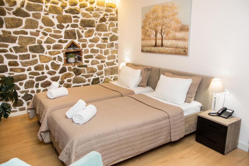 Postel nebo postele na pokoji v ubytování Arxontiko Hotel