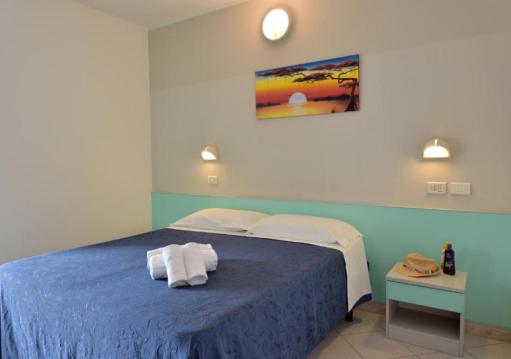 Postel nebo postele na pokoji v ubytování Hotel Oltremar B&B