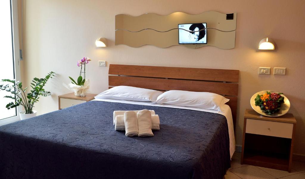 Postel nebo postele na pokoji v ubytování Hotel Oltremar B&B