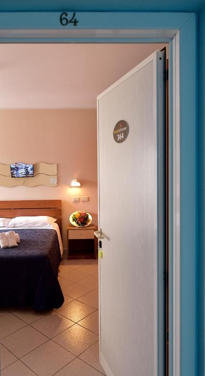 Postel nebo postele na pokoji v ubytování Hotel Oltremar B&B