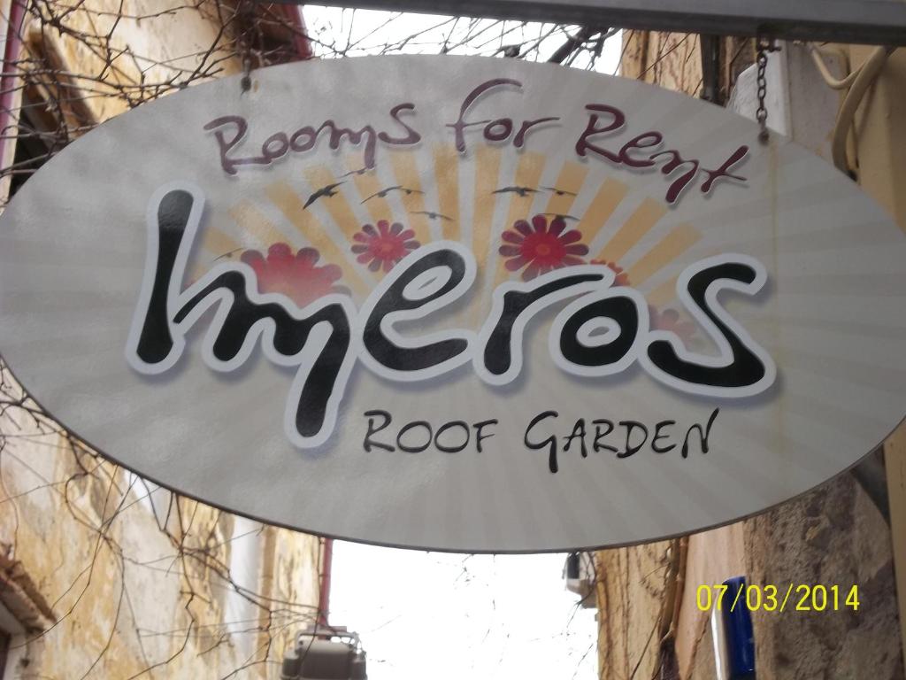 a sign that reads rooms for rent fires roof garden at Imeros in Chania Town