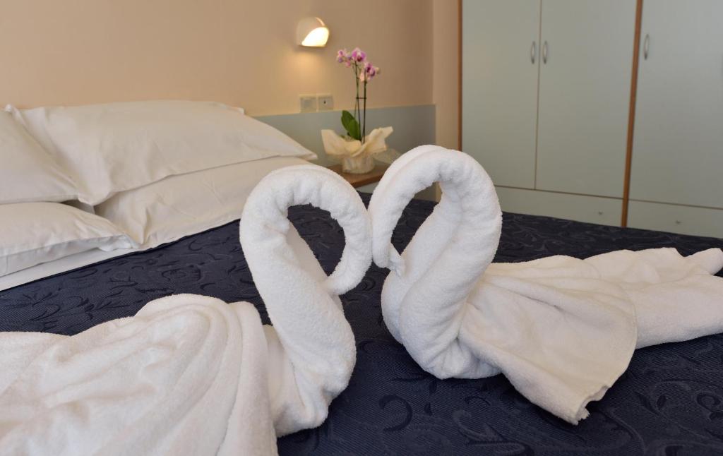 Postel nebo postele na pokoji v ubytování Hotel Oltremar B&B