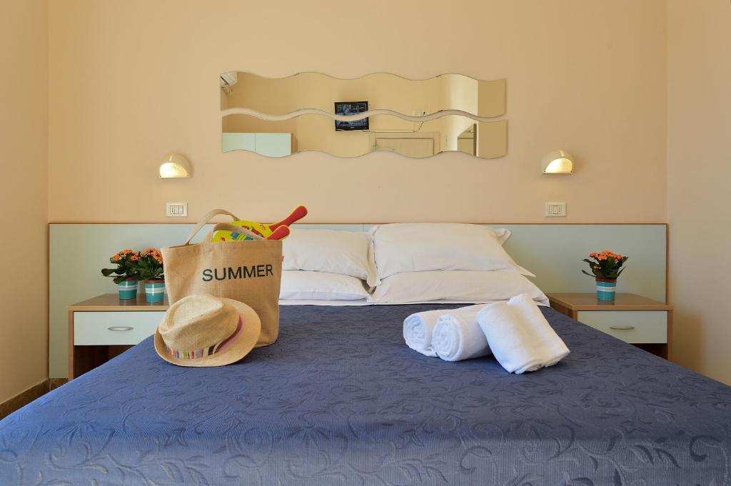 Postel nebo postele na pokoji v ubytování Hotel Oltremar B&B