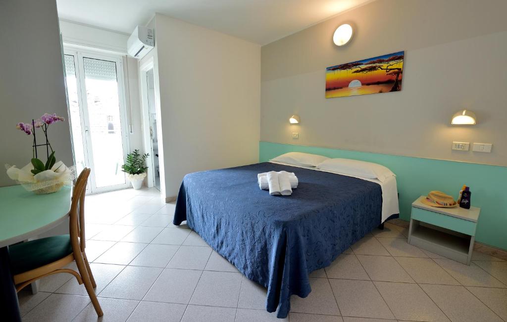 Postel nebo postele na pokoji v ubytování Hotel Oltremar B&B