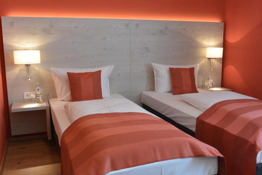 Postel nebo postele na pokoji v ubytování Hotel Schlee