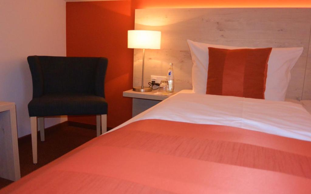 Postel nebo postele na pokoji v ubytování Hotel Schlee