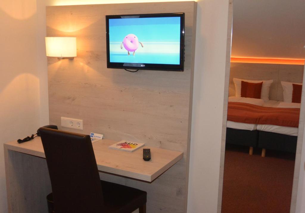 TV a/nebo společenská místnost v ubytování Hotel Schlee
