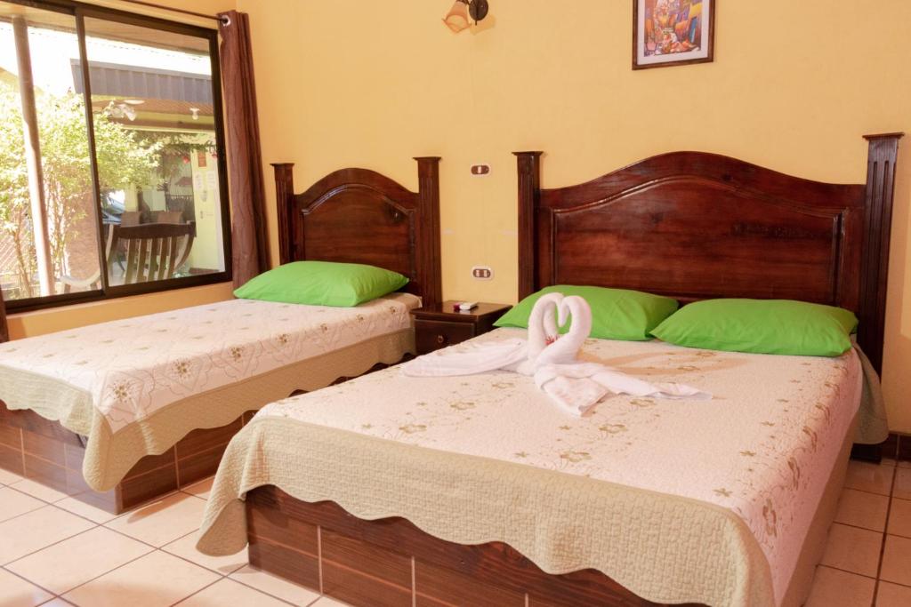 Llit o llits en una habitació de Hotel Villa Hermosa