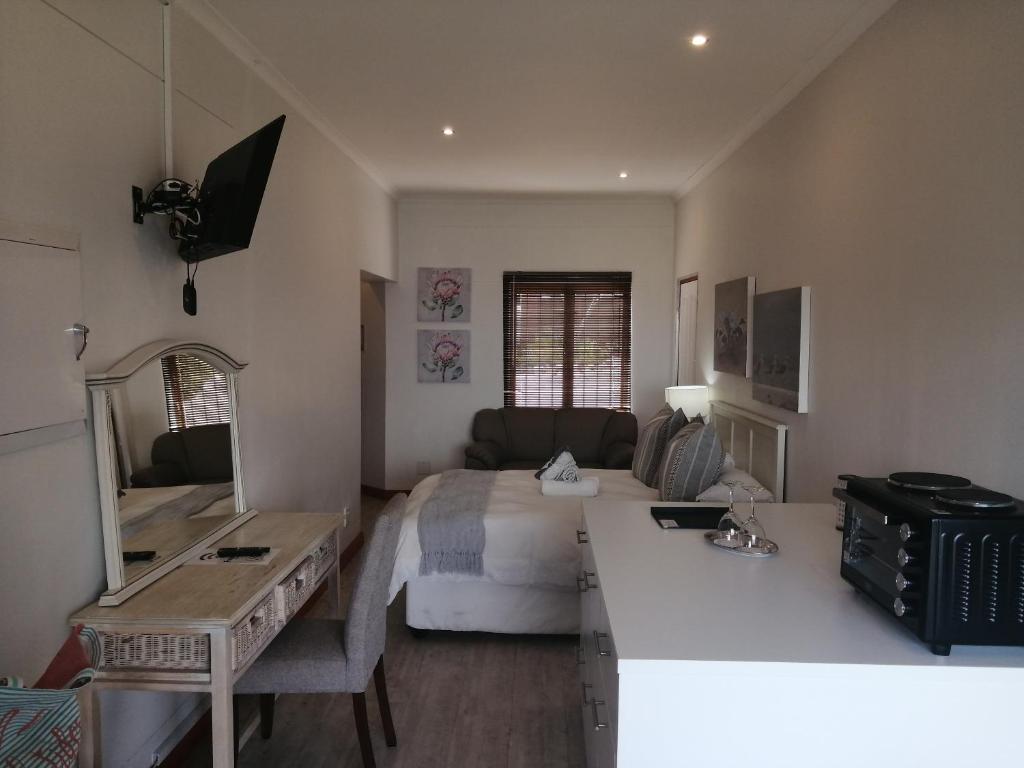 TV o dispositivi per l'intrattenimento presso Knysna Pearl View Guest House