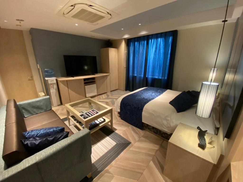 Postel nebo postele na pokoji v ubytování ルトゥール姫路 Retur HIMEJI 男塾ホテルグループ