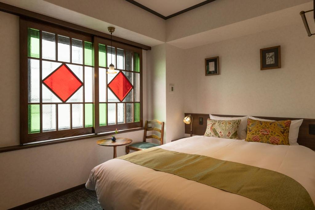 Postel nebo postele na pokoji v ubytování Hotel Aru Kyoto Sanjo Kiyamachi Do-ri