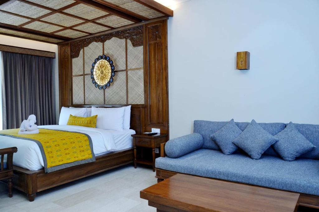 Postel nebo postele na pokoji v ubytování Kenran Resort Ubud By Soscomma