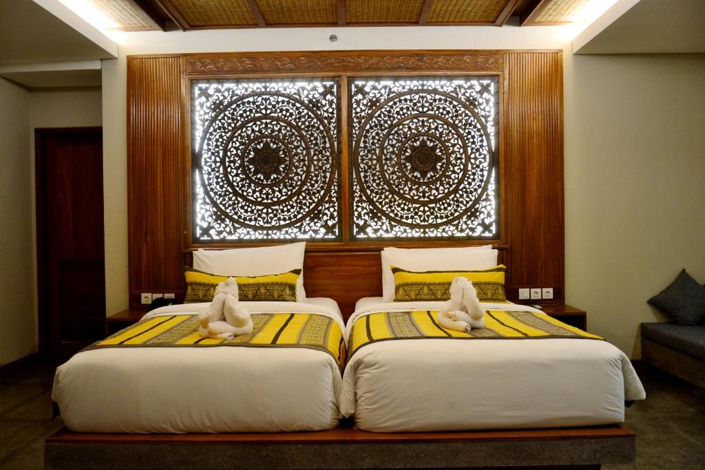 Postel nebo postele na pokoji v ubytování Kenran Resort Ubud By Soscomma