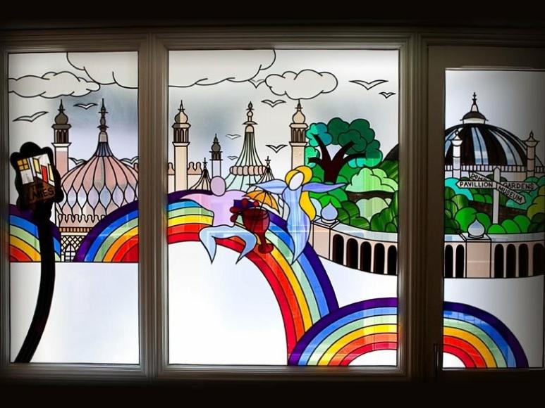 a window with a view of a rainbow and a city at Guest And The City in Brighton & Hove