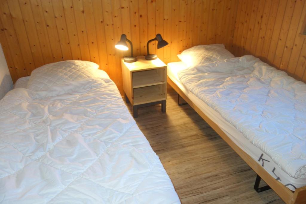 Postel nebo postele na pokoji v ubytování Melezes K SKI LIFT & NATURE apartments by Alpvision Résidences