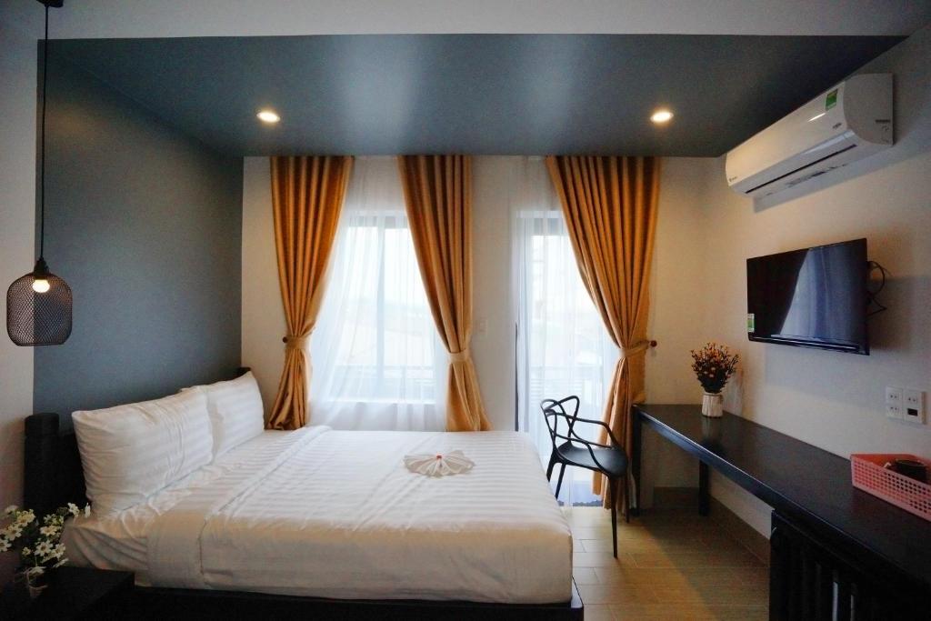 Postel nebo postele na pokoji v ubytování Maison Khoi Homestay