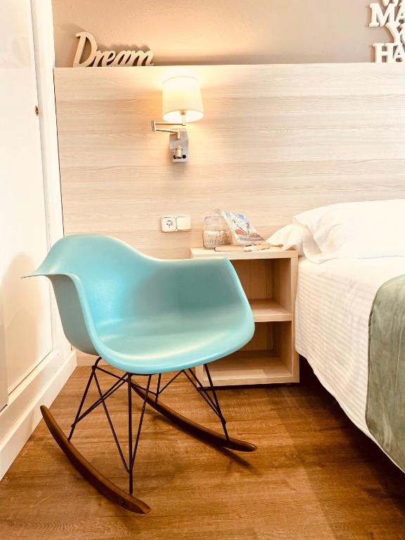 Postel nebo postele na pokoji v ubytování Hotel Carbonell