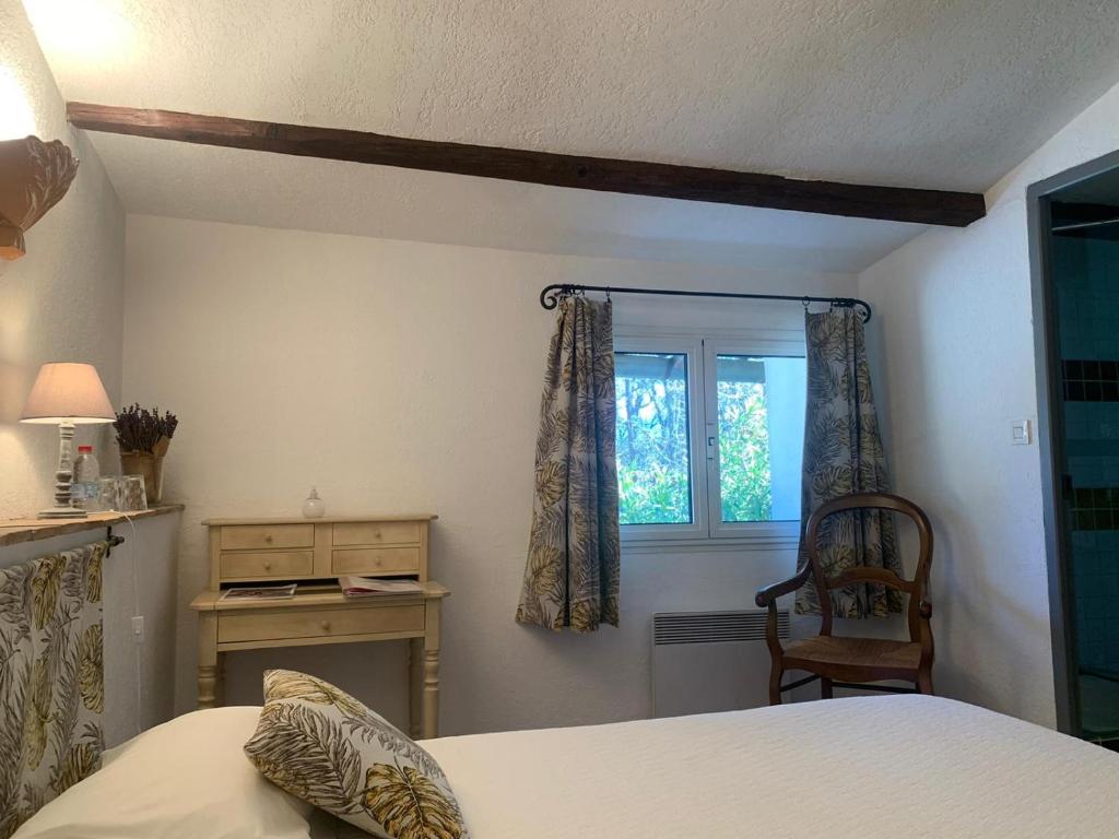 Postel nebo postele na pokoji v ubytování Bastide Sainte Agnès