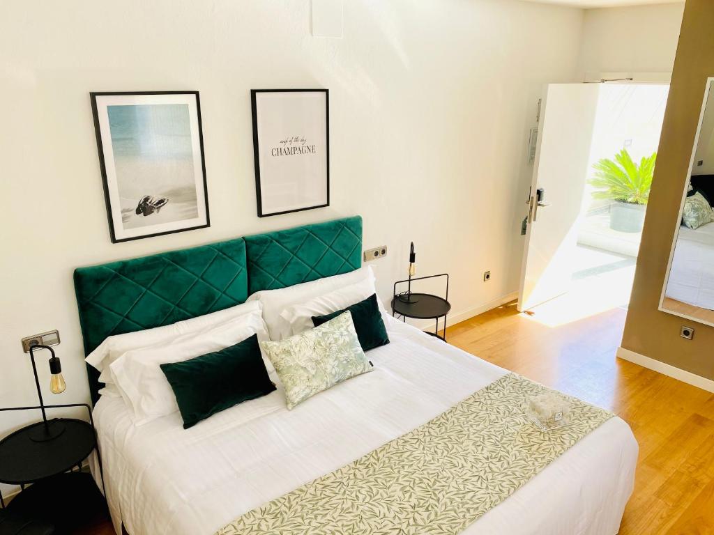 Postel nebo postele na pokoji v ubytování Hotel Carbonell